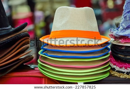 Pile of colorful hats are on sale at the marketplace