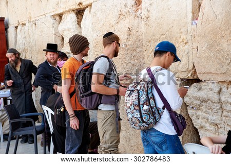 JERUSALEM, ISRAEL - JUNE 4, 2015: Western Wall also known as Wailing Wall or Kotel in Jerusalem. People from all over the world come to pray.