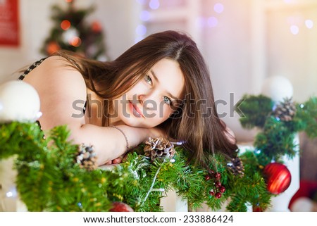 Closeup portrait of sweet teen girl on Christmas tree background, New Year children\'s party