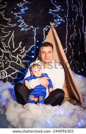 the family in the winter forest in a tent . (Studio)