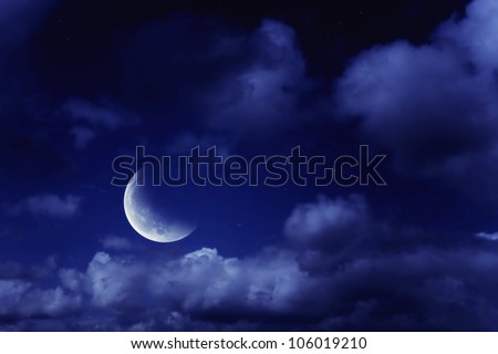 Night landscape with the moon in a cloudy sky