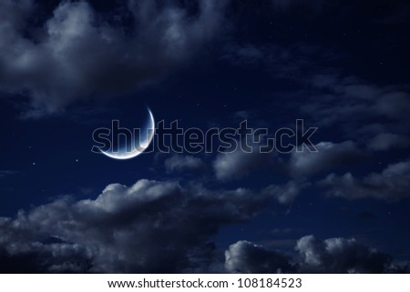 The moon in the night cloudy sky with stars