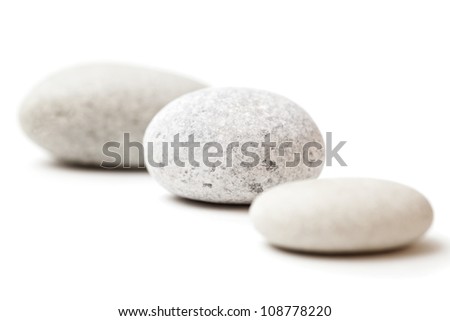 three gray spa stones isolated on white background three gray spa stones isolated on white background