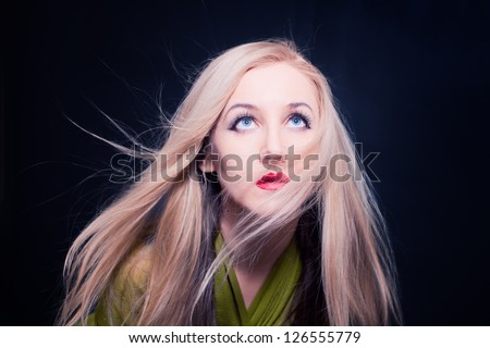 woman with hair fluttering in wind closeup