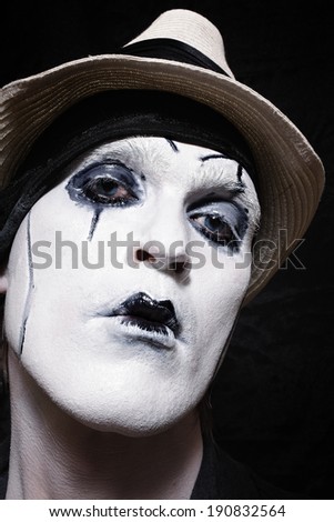Portrait of a theatrical actor with dark makeup closeup