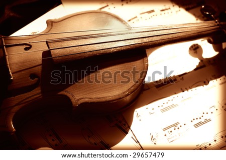 Old violin and musical notes