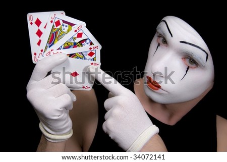 Portrait of mime  with royal flush