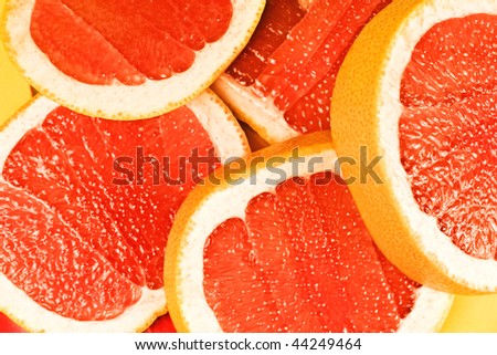 Parts of a red grapefruit close up