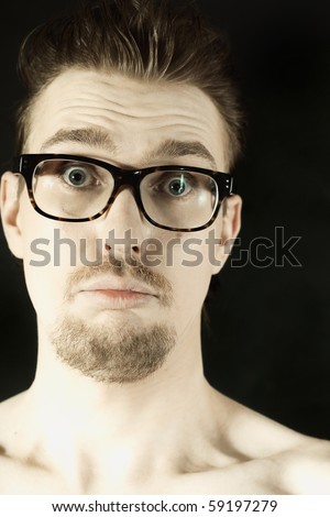 man in glasses with funny face closeup