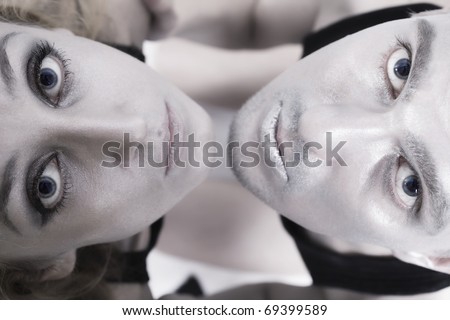 Portrait of young man and woman with silver makeup