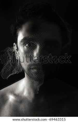 Portrait of young man with  crazy look closeup