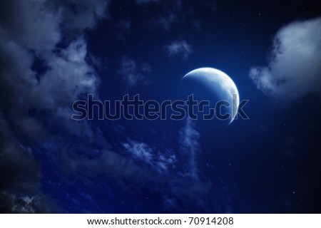 stock photo moon and stars in a cloudy night blue sky