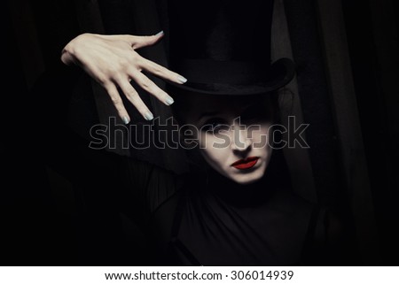 Portrait of Woman wearing a high hat closeup