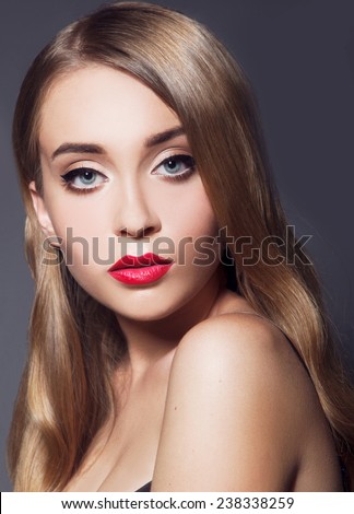 Model with chic lips make-up with red lips