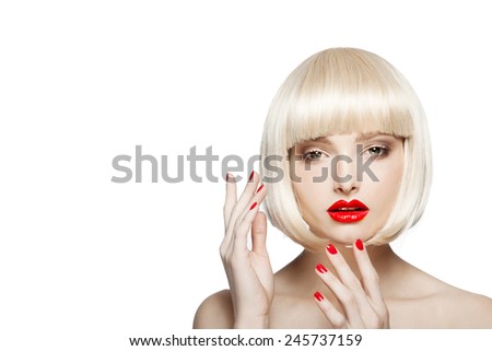 portrait of a beautiful woman in short blond bob wig with bright make-up, red lips,red nails,pretty young girl
