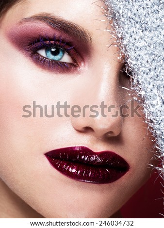 Blue Eyes Closeup.Beautiful Fashion Girl with Arrow Make up. Closeup Female eye with Beautiful Fashion bright makeup