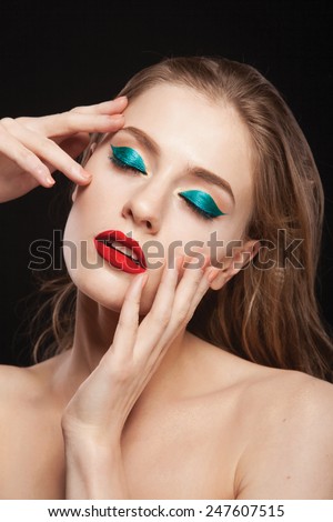 young fashion woman beauty portrait with  bright make up in black background