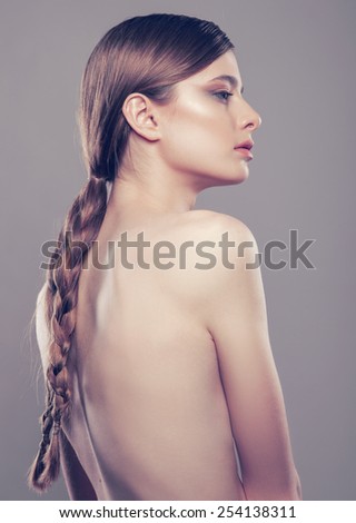 hair,beauty portrait of pretty woman with braid hair-style, creative starry make-up and stylish necklace.