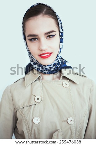 portrait of sexy smiling caucasian young woman model with glamour red lips,bright makeup, eye arrow makeup, purity complexion. Perfect clean skin.white teeth,leopard scarf