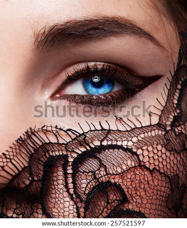 Beautiful fashion girl with arrow make up. Closeup female eye with beautiful fashion bright makeup.