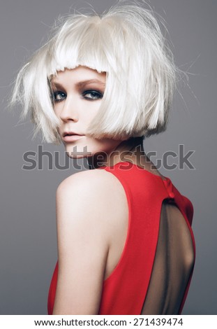 Close-up portrait of beautiful model with bright make up, on grey background fashion party style, white wig