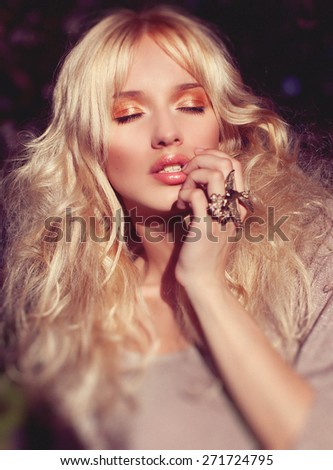 Fashion Beauty Blonde Model Girl with Beautiful spring girl in blooming tree\
 Flowers . Bride. Perfect Creative Gloss Make up and Hair Style. Hairstyle.