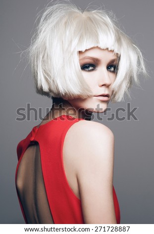 Close-up portrait of beautiful model with bright make up, on grey background fashion party style, white wig