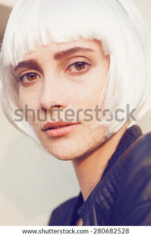 Beauty Woman with Perfect Makeup. Beautiful Professional  Makeup. Grid on the face,white wig