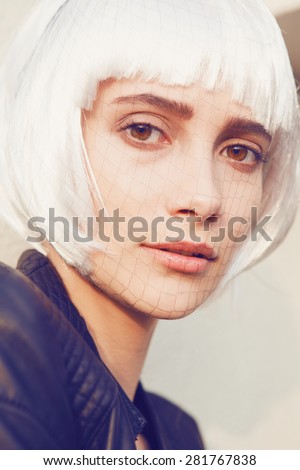 Beauty Woman with Perfect Makeup. Beautiful Professional Makeup. Grid on the face,white wig