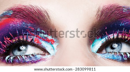 Colorful lashes,Macro shot of woman\'s beautiful eye with extremely long eyelashes. Sexy view, sensual look,blue eyes,art