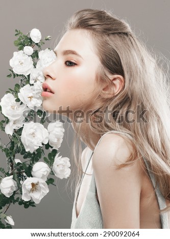 beauty close-up portrait young woman face with flowers