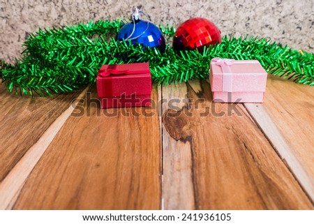 Red gift box decorations for Christmas,New Year and valentine on a wooden floor. Used for the background.