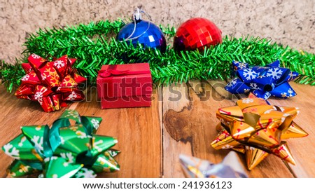 Red gift box decorations for Christmas,New Year and valentine on a wooden floor. Used for the background.