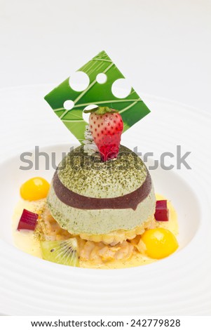 Dome green tea mousse parfait decorated with Mixed fruit and cube raspberry jelly