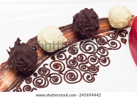 spiral chocolate decoration and chocolate praline