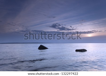 Beautiful moody sunrise over the Swedish ocean, wide angle photo