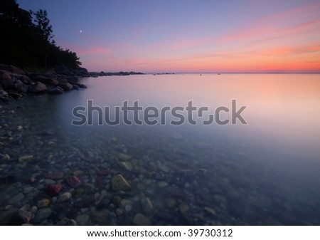 Beautiful sunset from a Swedish bay. Wide angle photo.