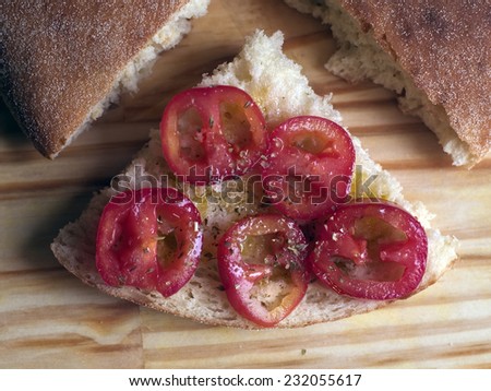 Italian snack - Homemade arabic bread with tomato, olive oil, oregano and salt