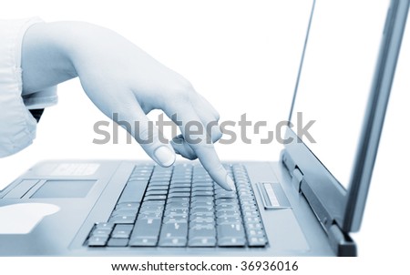 Closeup of notebook. Woman\'s hand touching notebook (laptop) keys during work. Isolated on white.