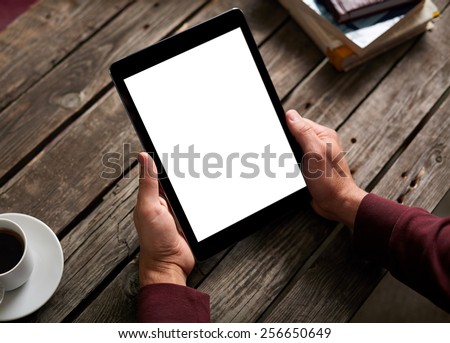 Man shows screen of digital tablet in his hands. Clipping path included.
