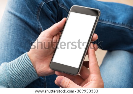 Smartphone in man\'s hands. View from above. Clipping path included.
