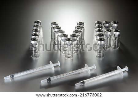 IVF icon (in vitro fertilization), formed from medical ampoules with three syringes in front, silver gray background