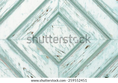 Weathered wooden door with symmetrical diamond pattern - Template for backgrounds