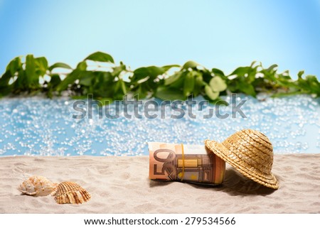 Savings for vacation, pack of fifty Euro bills under a sunhat at the beach
