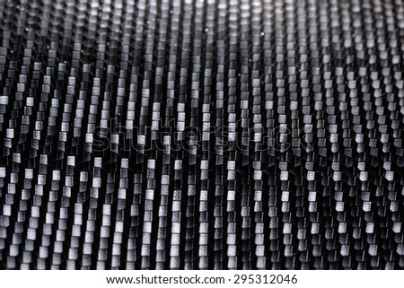 Black structured background with honeycomb pattern.