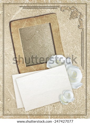 Old grunge photo frame with roses and paper for letter