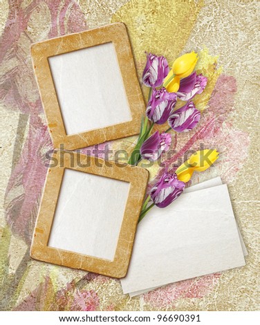 Old grunge photo frame with tulips and paper for letter