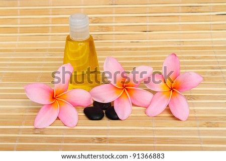 Tropical spa concept with plumeria flower and stones