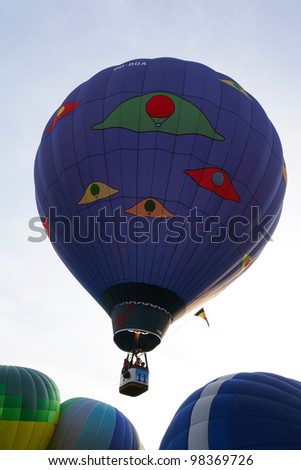 PUTRAJAYA, MALAYSIA - MAR 19 : A hot air balloon from Belgium in flight at the 4th Putrajaya International Hot Air Balloon Fiesta on 19 Mar, 2012 in Putrajaya. 23 balloons participate in this year.