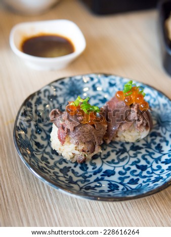 Fusion food of beef sushi topping with Ikura